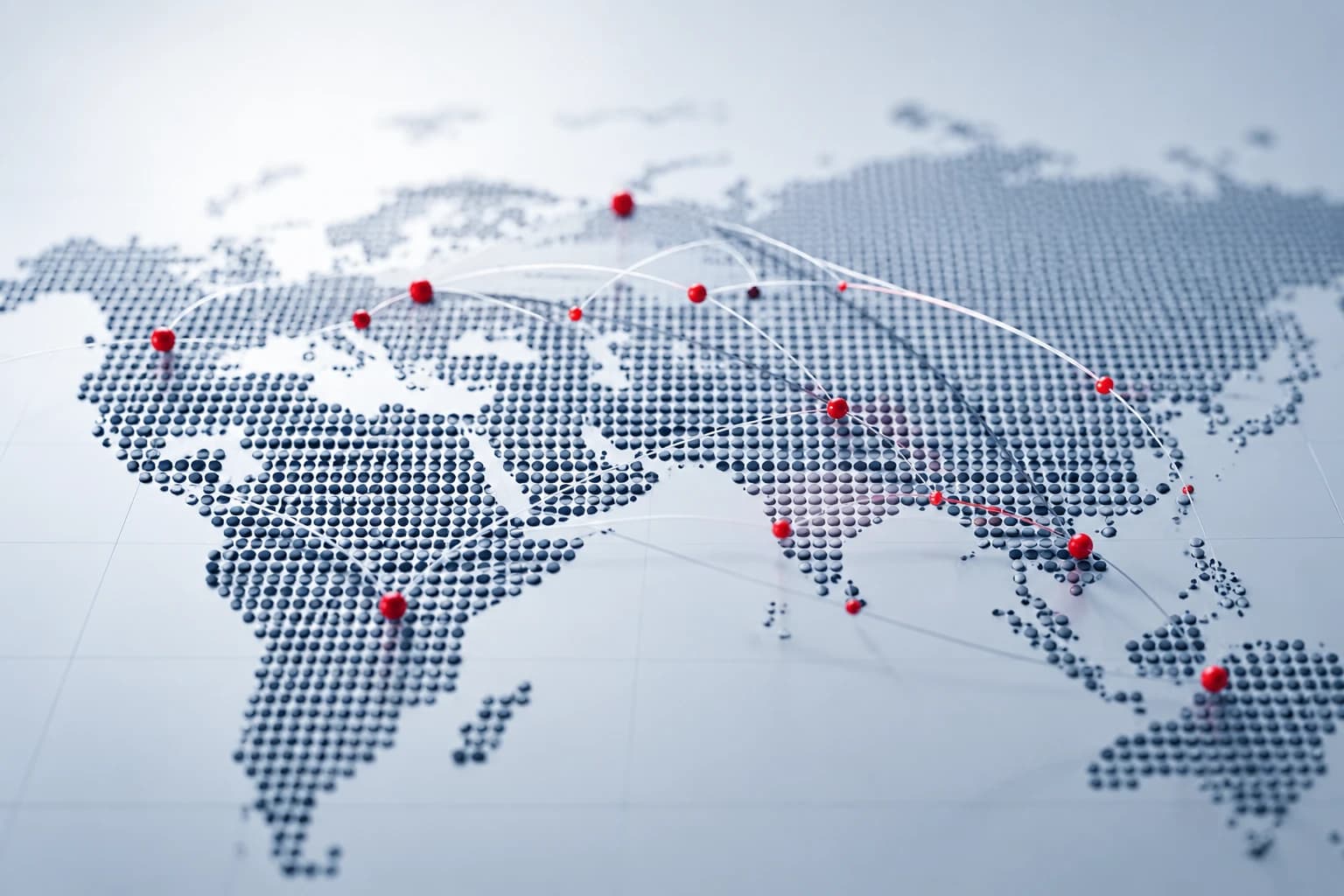 A dotted world map with red markers and connecting arcs between regions